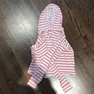 A pink and white striped, thin material, hoodie.